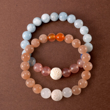 Main image of stacked bracelets with pastel gemstone combination.
