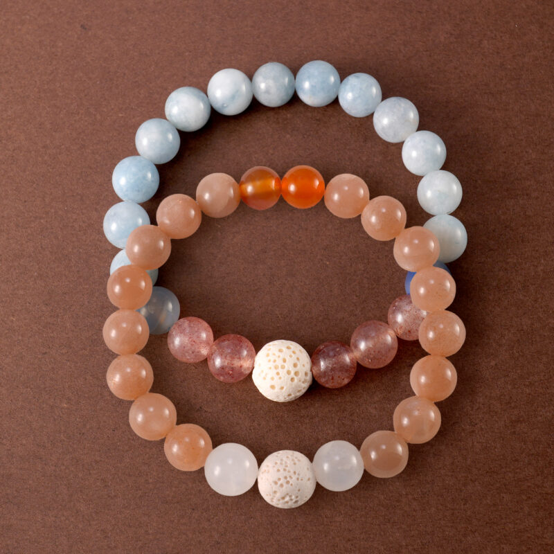 Main image of stacked bracelets with pastel gemstone combination.