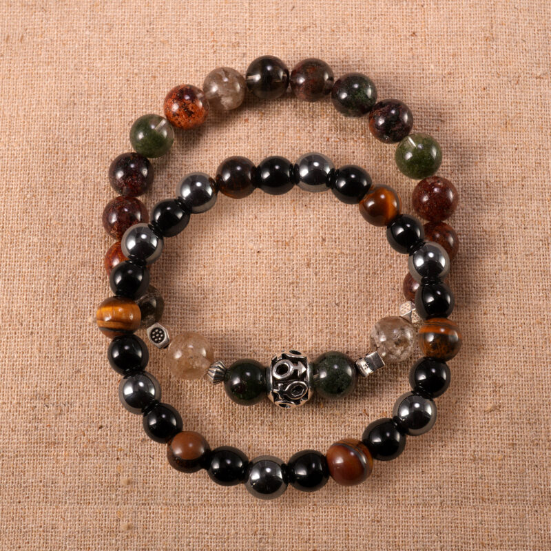 Main image of stacked bracelets with phantom quartz and dark stone mix.