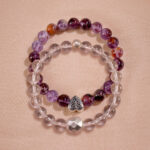 Main product image of stacked bracelets with purple phantom and clear quartz.