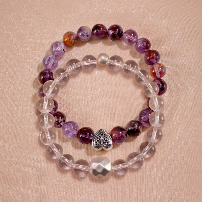 Main product image of stacked bracelets with purple phantom and clear quartz.