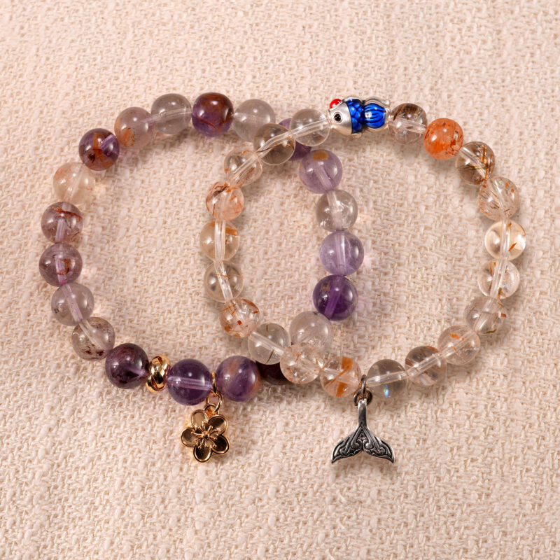 Main image of stacked bracelets: purple phantom and rutilated quartz.