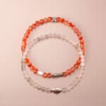 Main image of red carnelian and white chalcedony stacked bracelets.