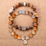 Main image of stacked bracelets: striped agate and picture jasper with blue chalcedony.