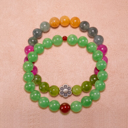 Main image showing stacked bracelets of tourmaline and aventurine-red agate mix.
