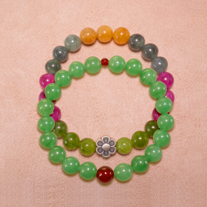 Main image showing stacked bracelets of tourmaline and aventurine-red agate mix.