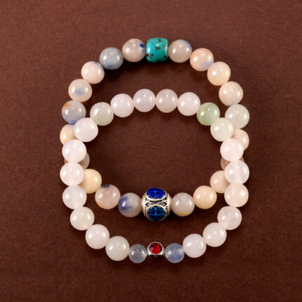 Main image of stacked bracelets: turquoise, chalcedony, and ruby.