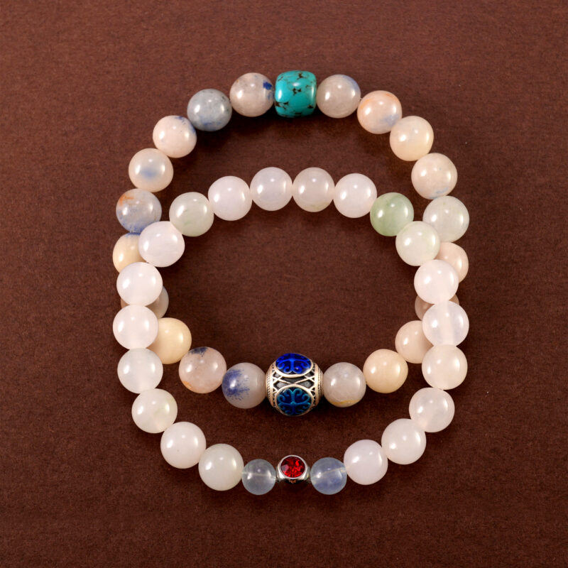 Main image of stacked bracelets: turquoise, chalcedony, and ruby.