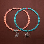 Main image of stacked turquoise, rhodochrosite and chalcedony bracelets.