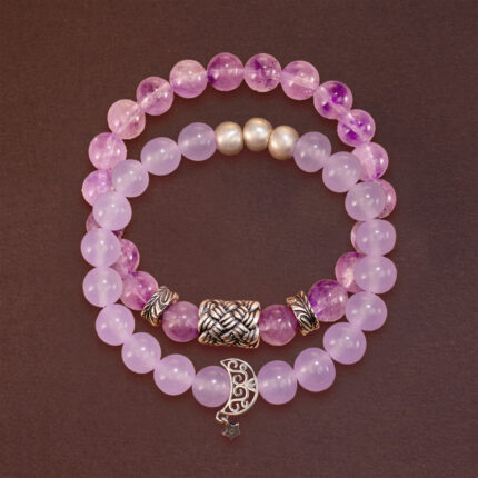 Main product image featuring two stacked amethyst crystal bracelets.