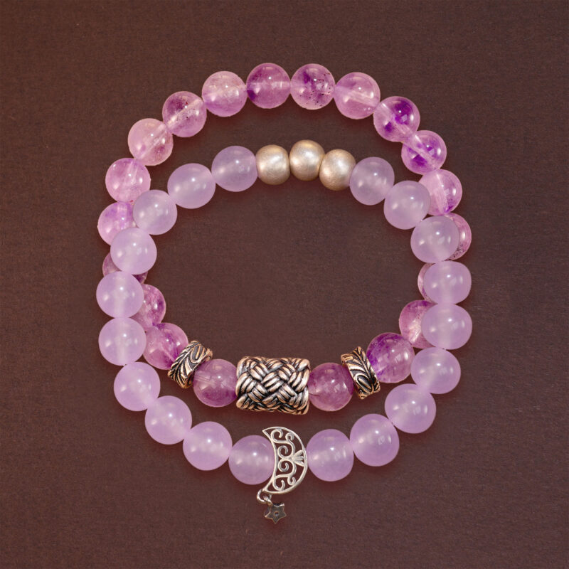 Main product image featuring two stacked amethyst crystal bracelets.
