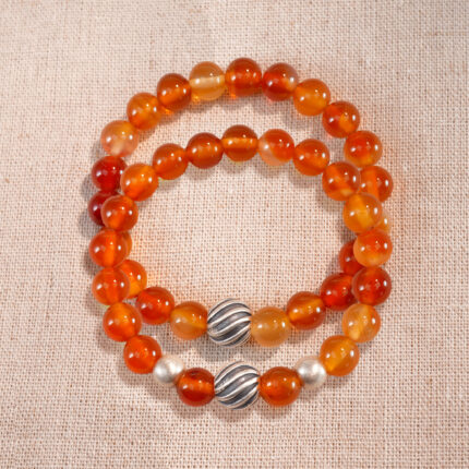 Main image featuring two stacked flower red agate bracelets.