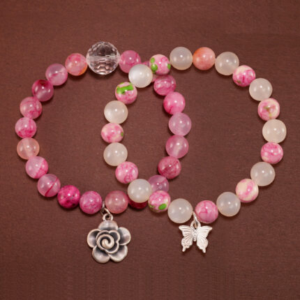 Main image showing stacked bracelets: white chalcedony mix and pink quartz.