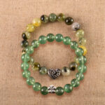 Main image of stacked moss agate and prehnite bracelets with S925 silver.