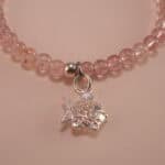 Close-up of strawberry quartz bracelet with silver.