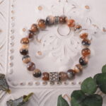 Striped agate bracelet in natural light showing soft bands and earthy tones.