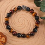 Tiger eye bracelet in natural light with golden-brown chatoyancy.