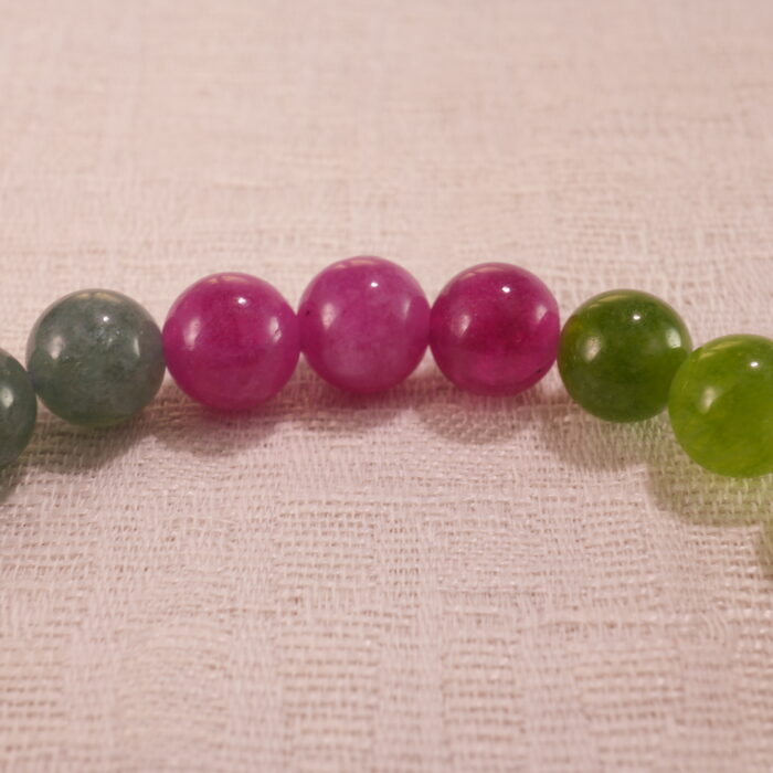 Close-up of tourmaline bracelet showing multicolored crystal beads.