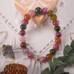 Tourmaline bracelet in natural light, showing vibrant gemstone colors.