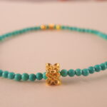 Close-up of turquoise bracelet showing natural texture and bead color.