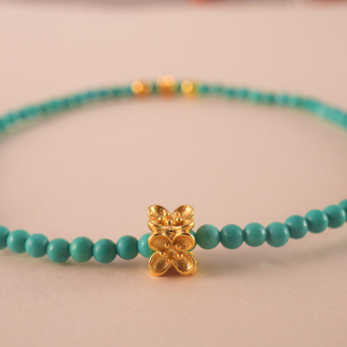 Close-up of turquoise bracelet showing natural texture and bead color.