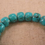 Close-up of turquoise bracelet with S925 silver details.