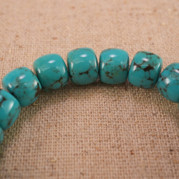 Close-up of turquoise bracelet with S925 silver details.