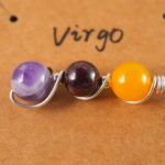 Close-up of Virgo necklace showing yellow agate, garnet, and amethyst beads.