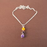 Virgo zodiac necklace with yellow agate, garnet, and amethyst gemstones.