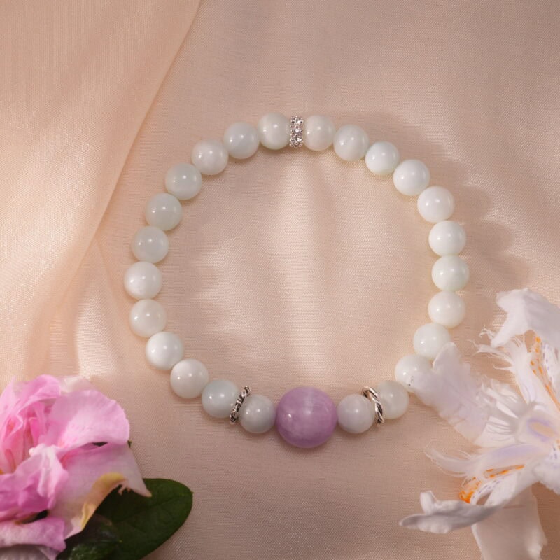 Bracelet in natural light with soft purple and white tones.