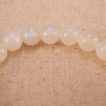 Close-up of white chalcedony and orange agate bracelet with S925 silver.