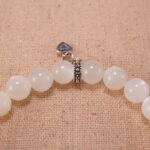 Close-up of white moonstone and blue apatite bracelet with S925 silver beads.