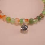 Close-up of yellow-green chalcedony bracelet with silver.