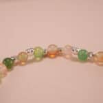 Close-up of yellow-green chalcedony bracelet with silver.
