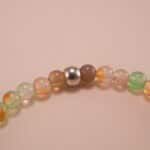 Close-up of yellow and green chalcedony bracelet with silver.
