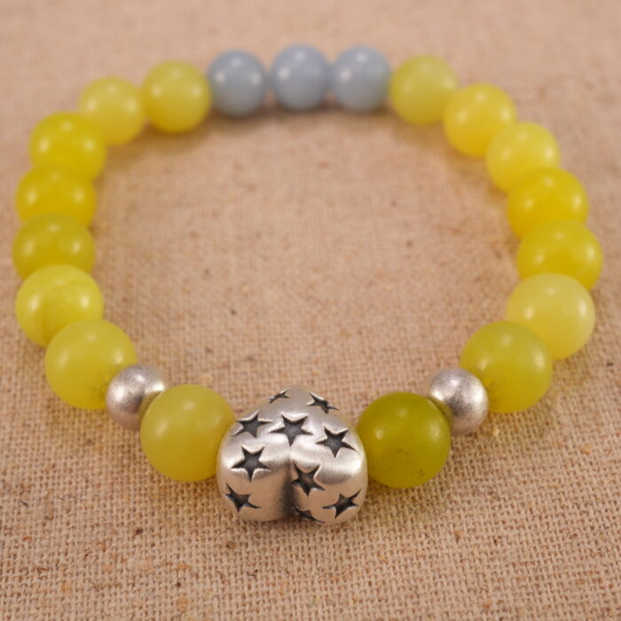 Close-up of yellow jade and blue chalcedony bracelet with S925 silver.