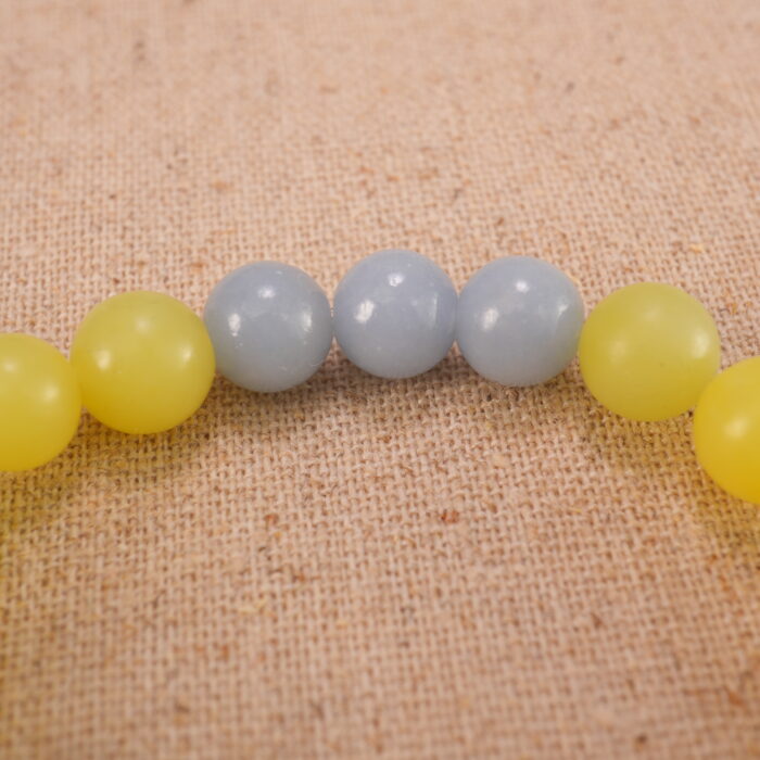 Close-up of yellow jade and blue chalcedony bracelet with S925 silver.