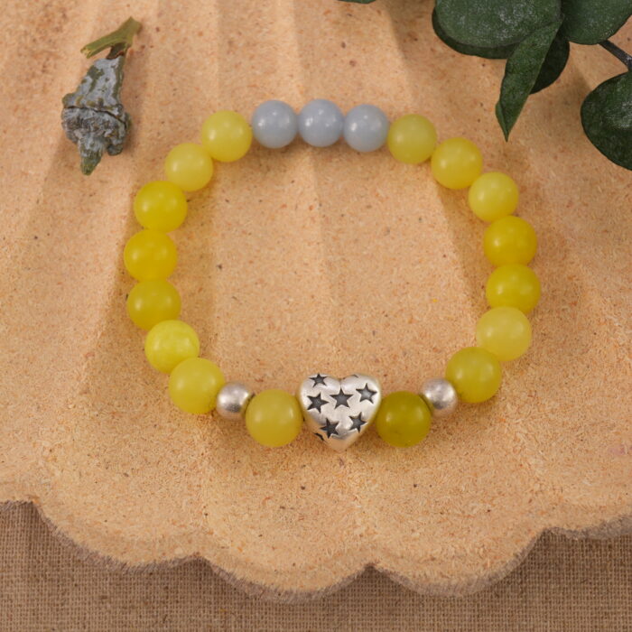 Bracelet in natural light with soft yellow and sky blue beads.