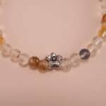 Close-up of yellow and white chalcedony bracelet with silver.