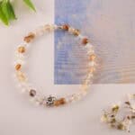 Bracelet in natural light with soft yellow and white tones.