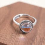 Close-up of the moonstone ring band and setting, highlighting the smooth cabochon cut and fine craftsmanship.