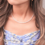 The adjustable natural pearl necklace displayed in a styled setting