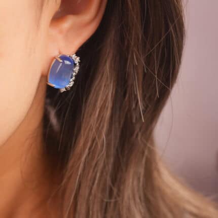 Model wearing the blue cat’s eye studs, subtly elegant and perfect for everyday wear.