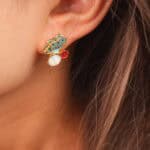 Model wearing butterfly opal studs, showing a fresh and sweet look.