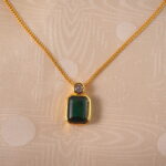 Close-up of emerald pendant necklace details