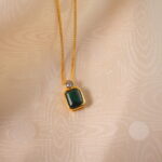 Close-up of emerald pendant necklace details