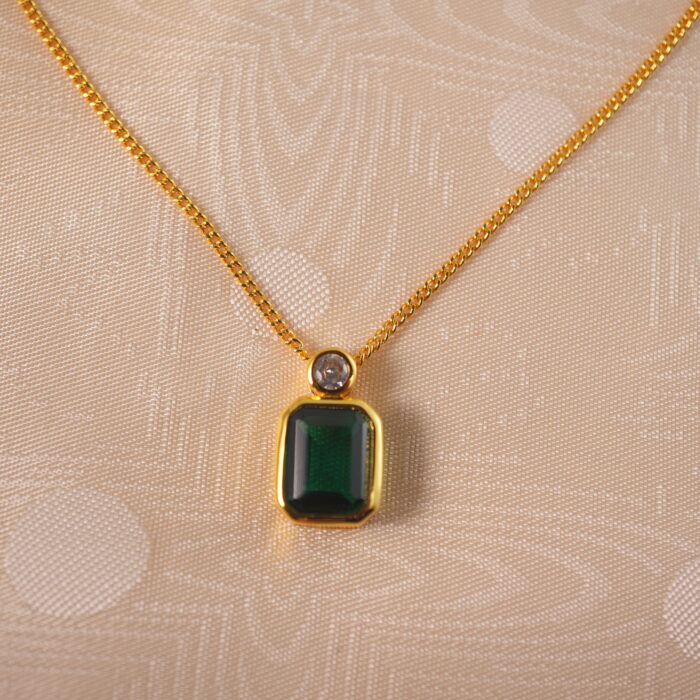 Close-up of emerald pendant necklace details