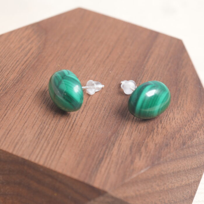 Close-up of the malachite stud earring, highlighting its unique green banding and polished finish.