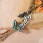 Close-up of the moonstone butterfly earring, showing delicate wing details and its dreamy sheen.