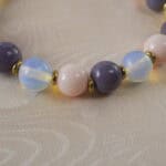 Close-up of the opal and pink chalcedony beads highlighting the natural textures and soft colors.